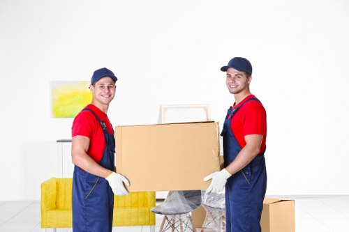 Local office removals planning with labels, boxes, and furniture in a Harlesden workspace