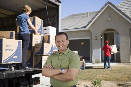 Packing and loading household items into a removals van
