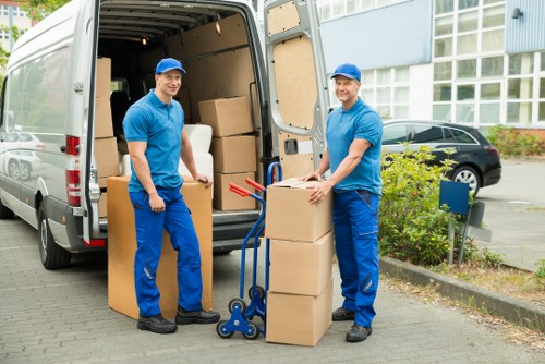 Local removals van near flats and terraces in Harlesden
