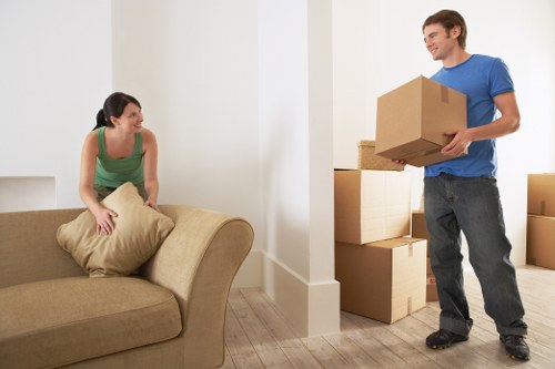 Packed moving boxes and furniture prepared for a home move