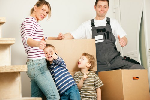 Packed moving boxes and furniture ready for transport